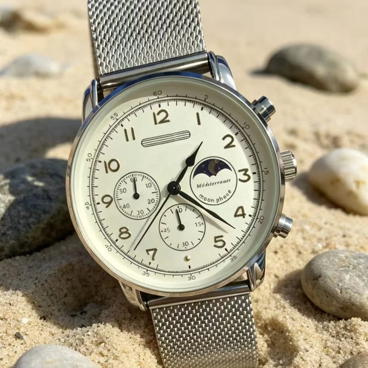 Moonphase watch with steel mesh bracelet on sand