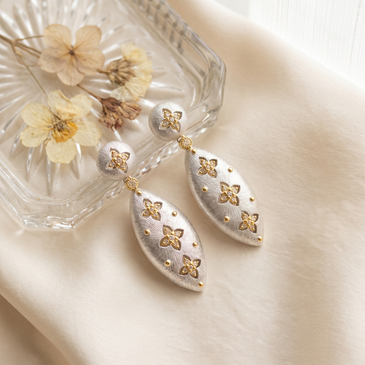 Elena Brushed Clover Drop Earrings on cream silk
