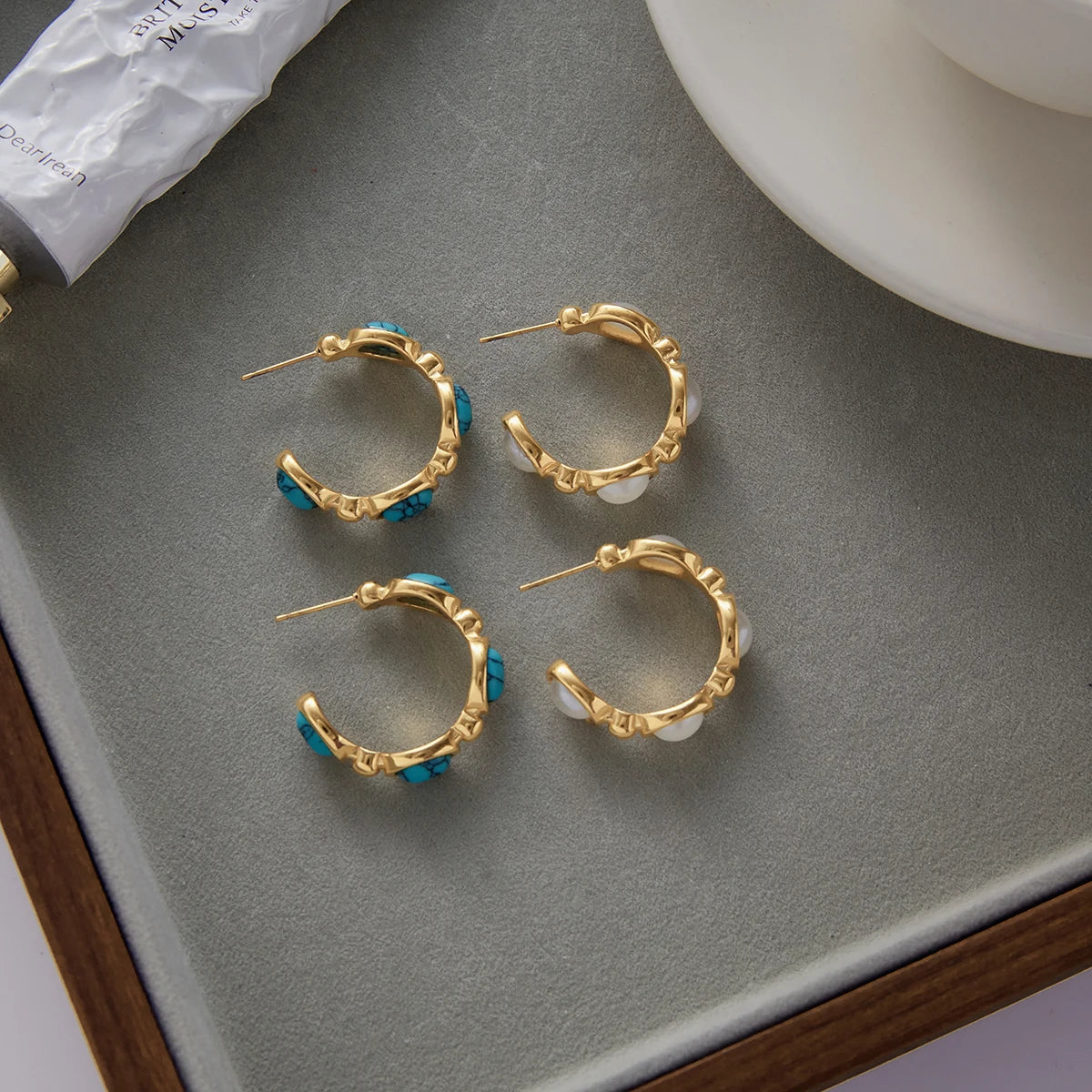 Santorini earrings styled flat-lay, turquoise and pearl