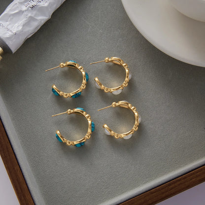 Santorini earrings styled flat-lay, turquoise and pearl