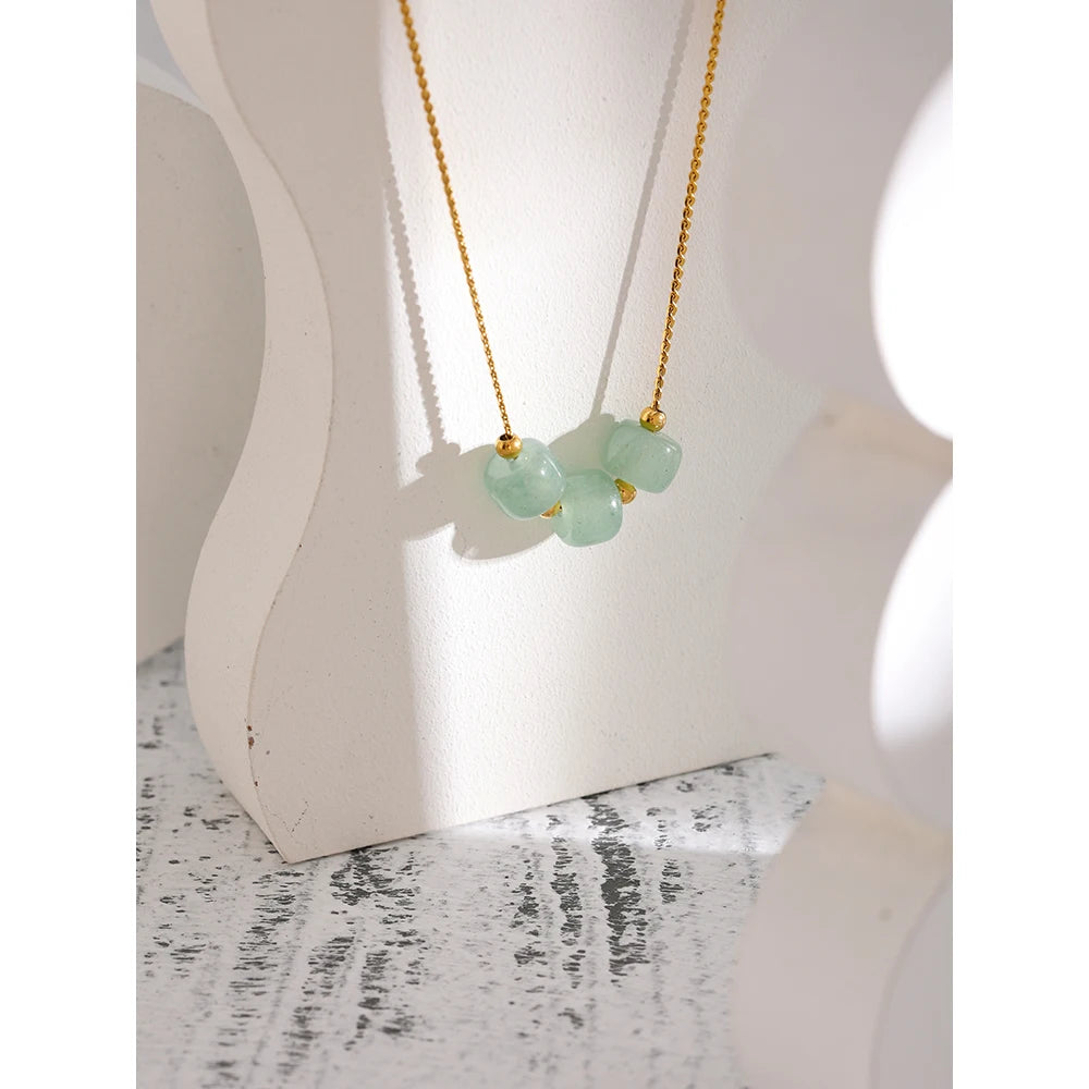 Juniper Aventurine Pendant Necklace styled on a white display stand