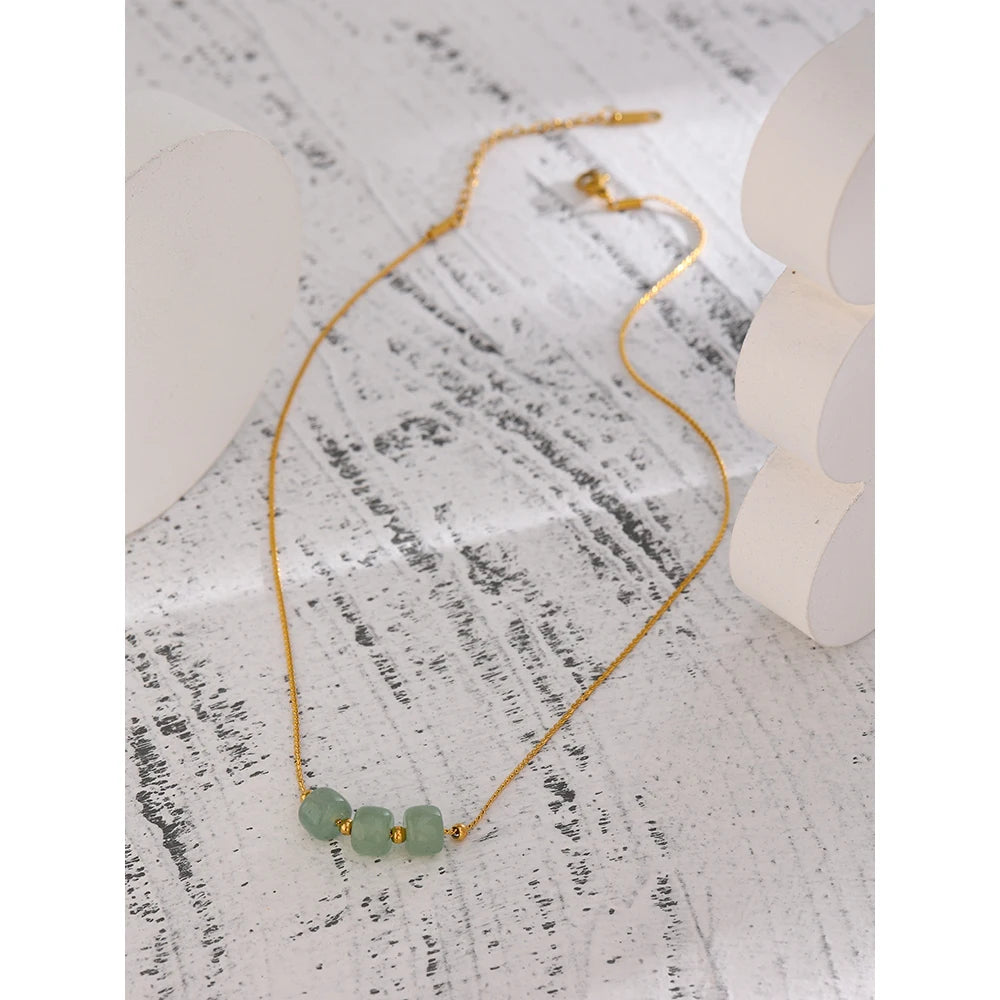 Juniper Aventurine Pendant Necklace laid flat on a textured surface