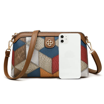 Indie crossbody front view with phone for scale