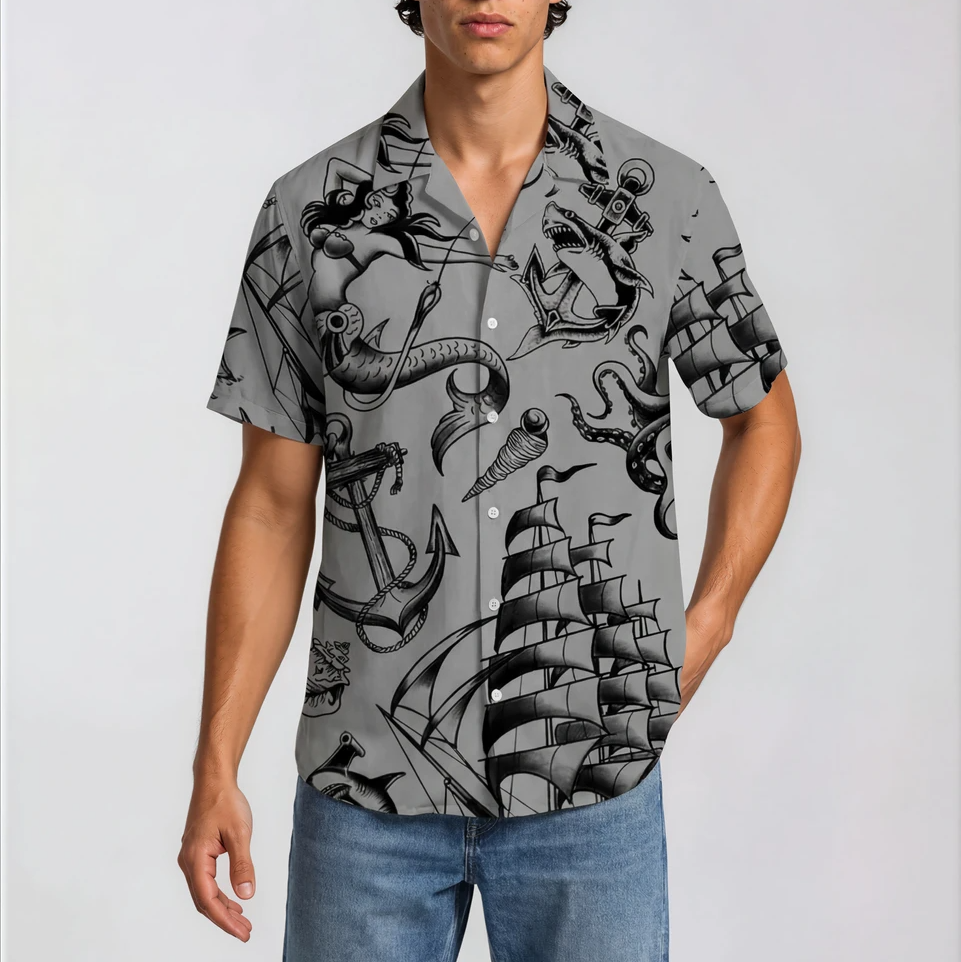 Man wearing a shirt with black nautical-themed design on a light gray background