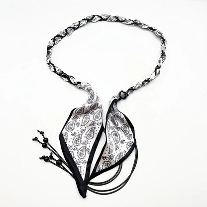 Ivy woven scarf belt in black paisley with beaded tassel ends