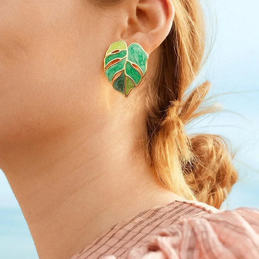 Monstera green leaf stud earrings worn
