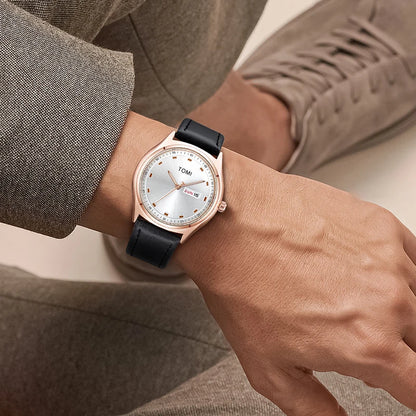 Emerson Minimalist Calendar Watch worn on the wrist, rose gold case with black strap