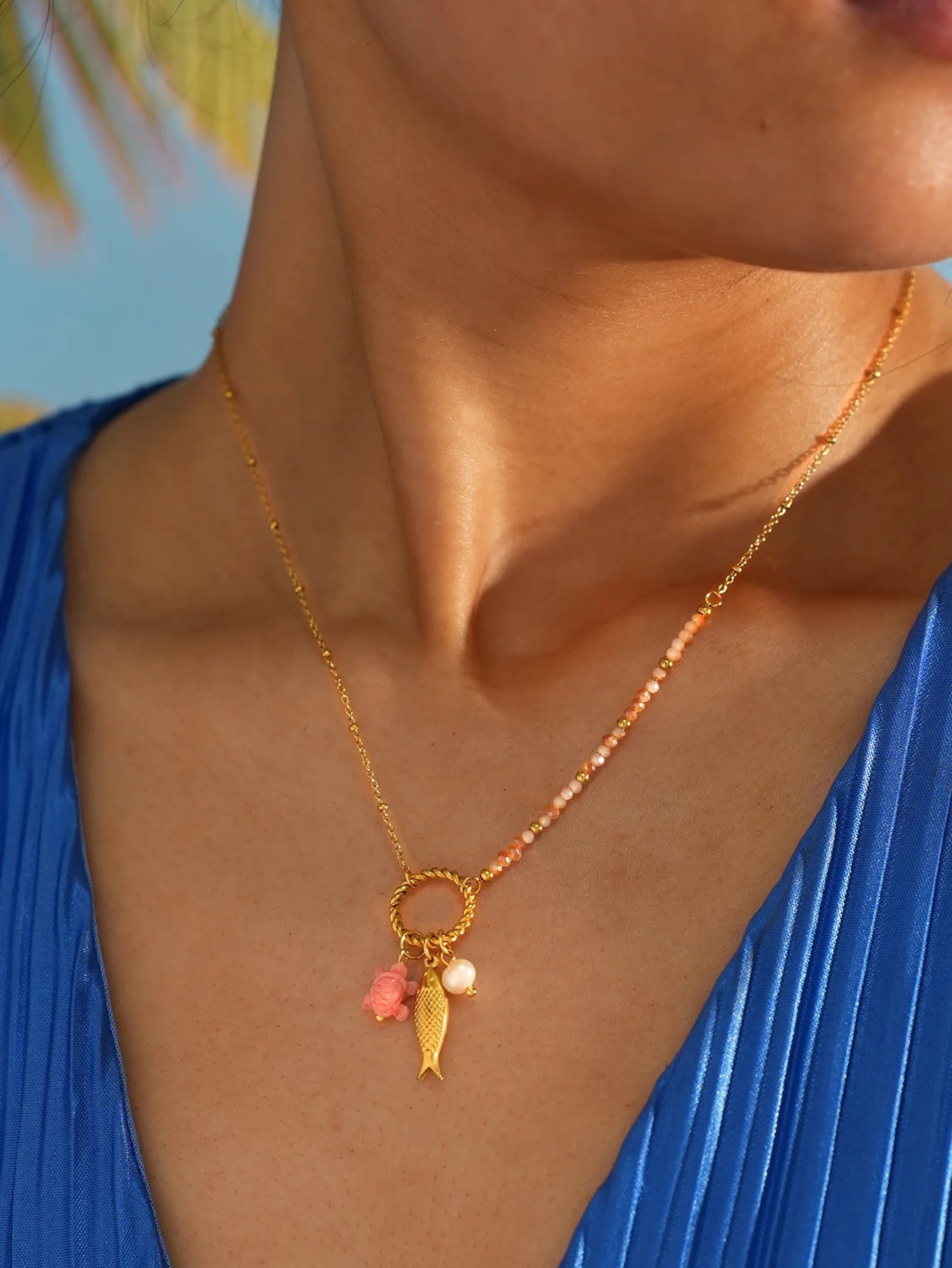Marina necklace worn with blue top