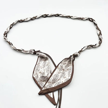 Ivy woven scarf belt in brown paisley knotted at the front