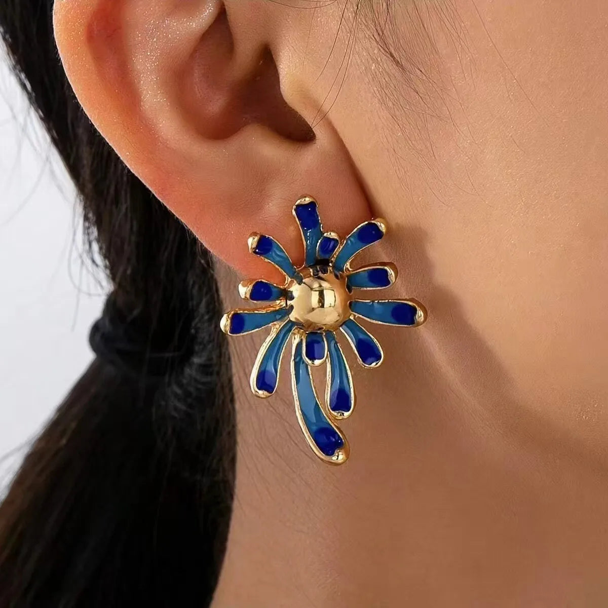 Solene earring detail on model