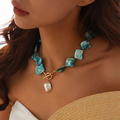 Nacre teal baroque shell choker on-model