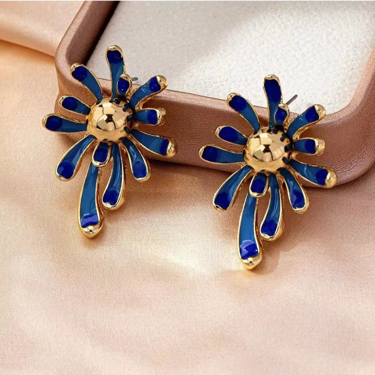 Solene blue enamel starburst earrings