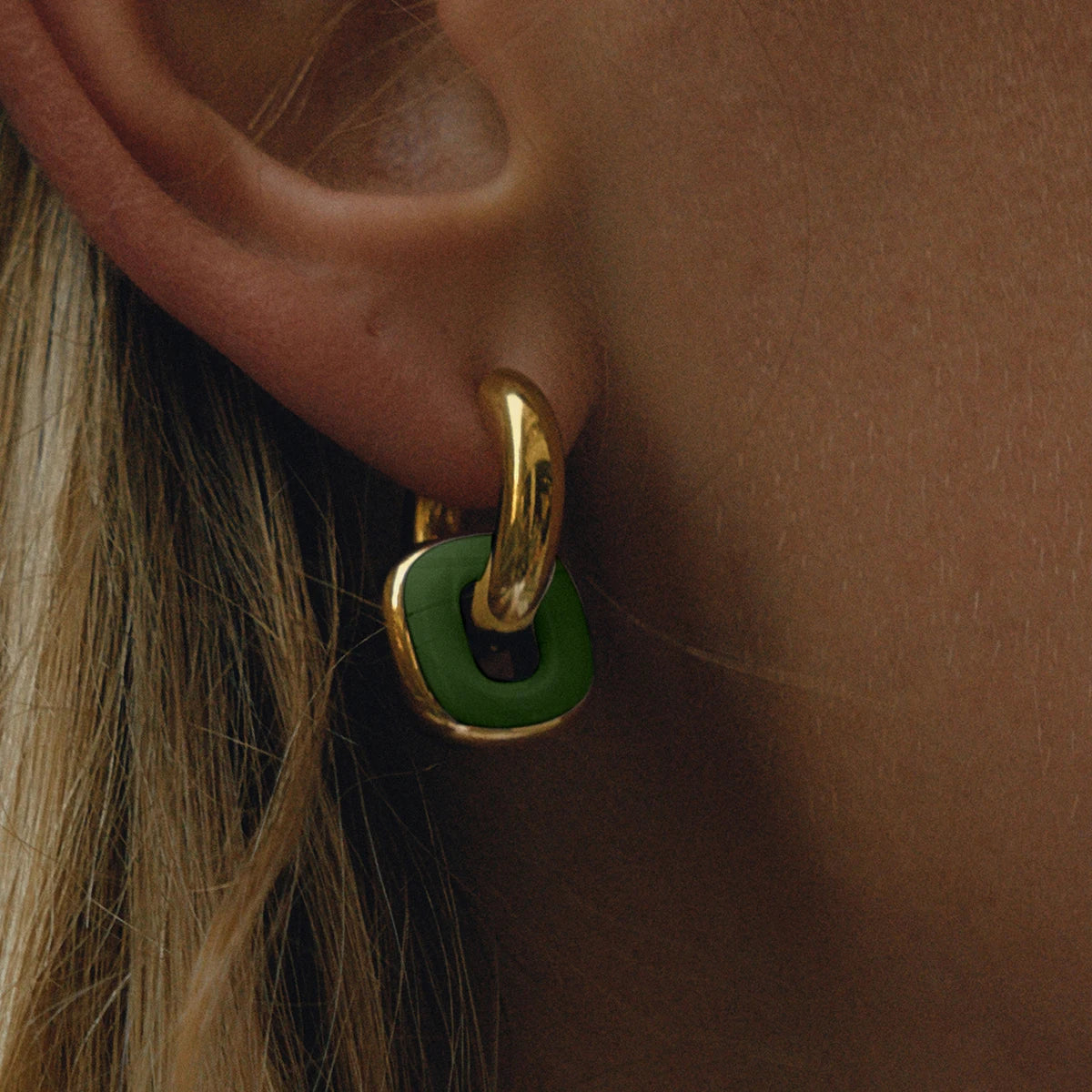 Noor green enamel earring on model