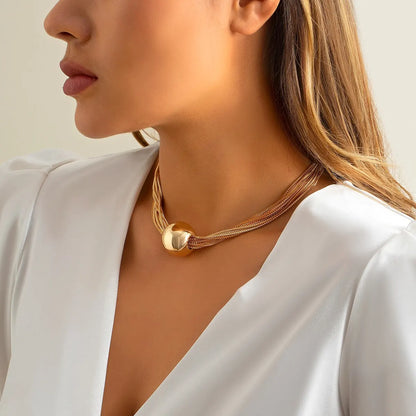 Gigi gold chain choker on model, side view