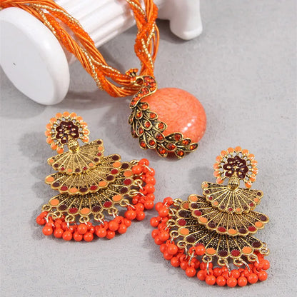 Alba Beaded Peacock Jewelry Set in Coral Orange, peacock pendant and beaded strands