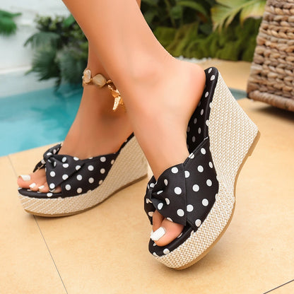 Mimi wedge slipper in black polka dot, worn