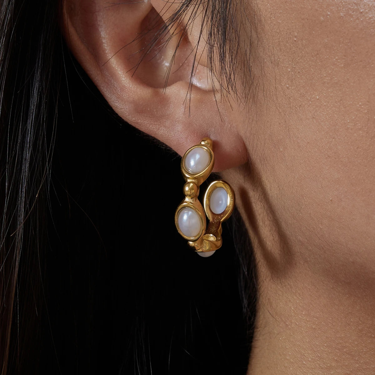 Santorini pearl earrings on model