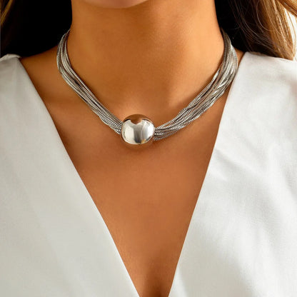 Gigi silver twisted chain choker with ball pendant, worn