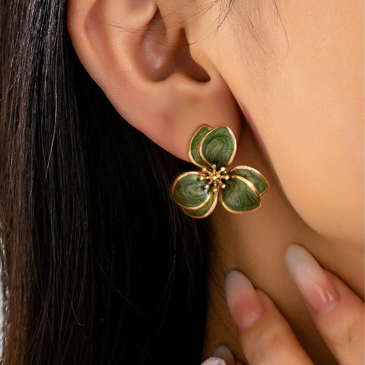 Flora enamel flower stud earrings in olive worn on model