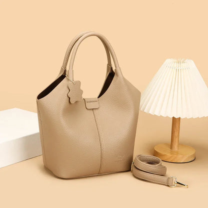 Lena leather bucket bag styled with detachable strap