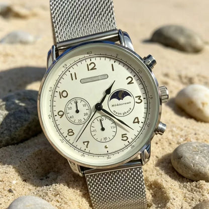 Moonphase watch with steel mesh bracelet on sand