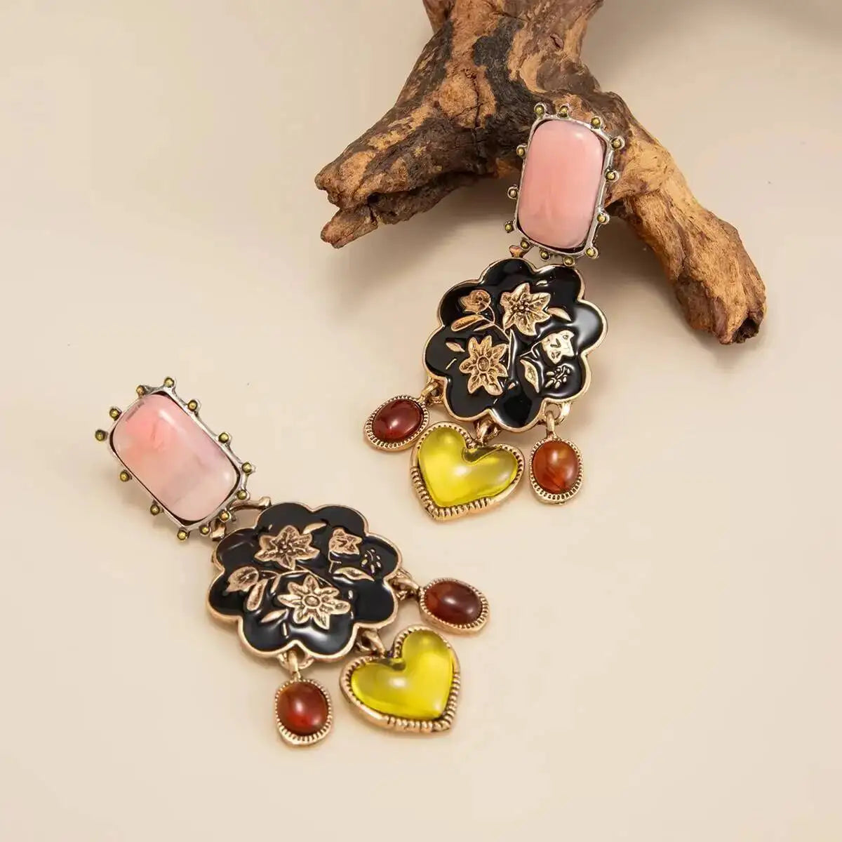 Bellamy vintage floral drop earrings styled flat lay on warm neutral backdrop