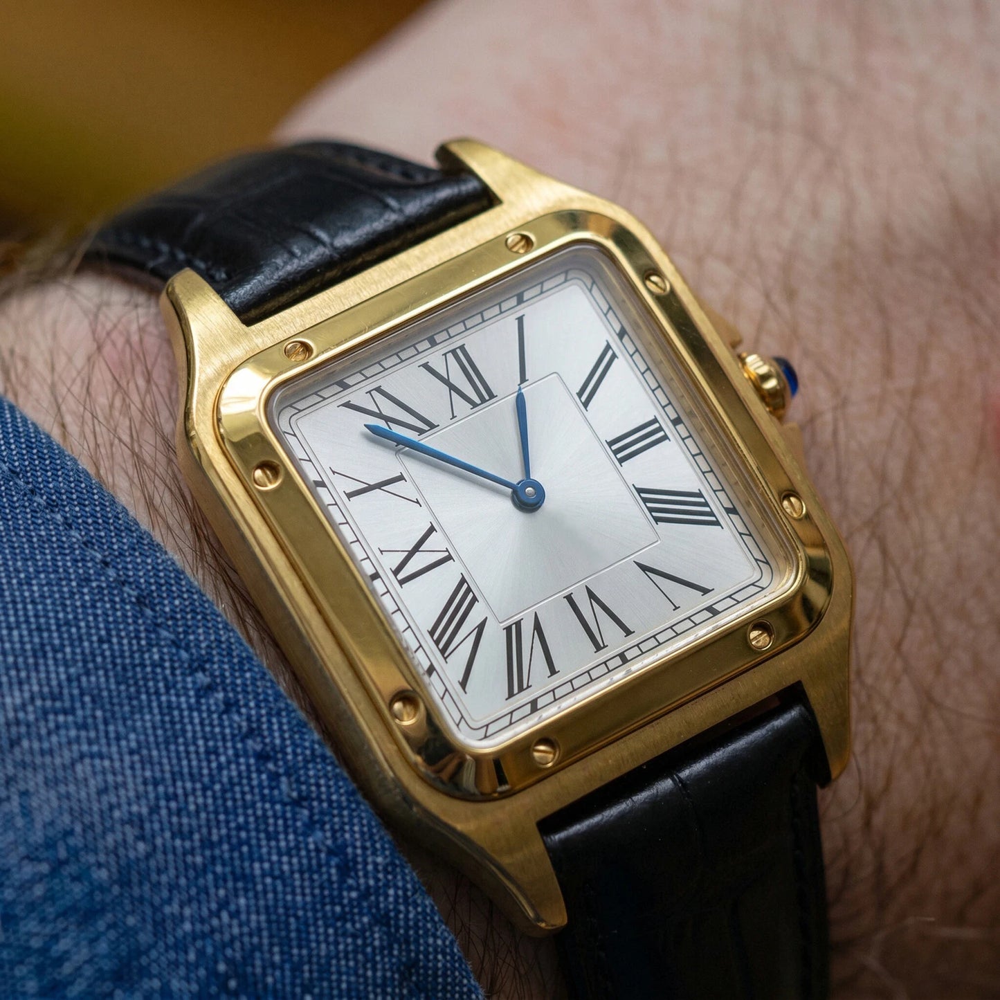 Ellis Gold Black Croc Watch worn on the wrist, gold square case with black croc leather strap