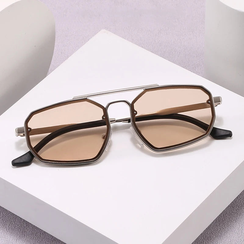Adele cat eye sunglasses styled on a plinth