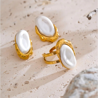 Anya faux pearl stud earrings and open ring styled on a stone surface
