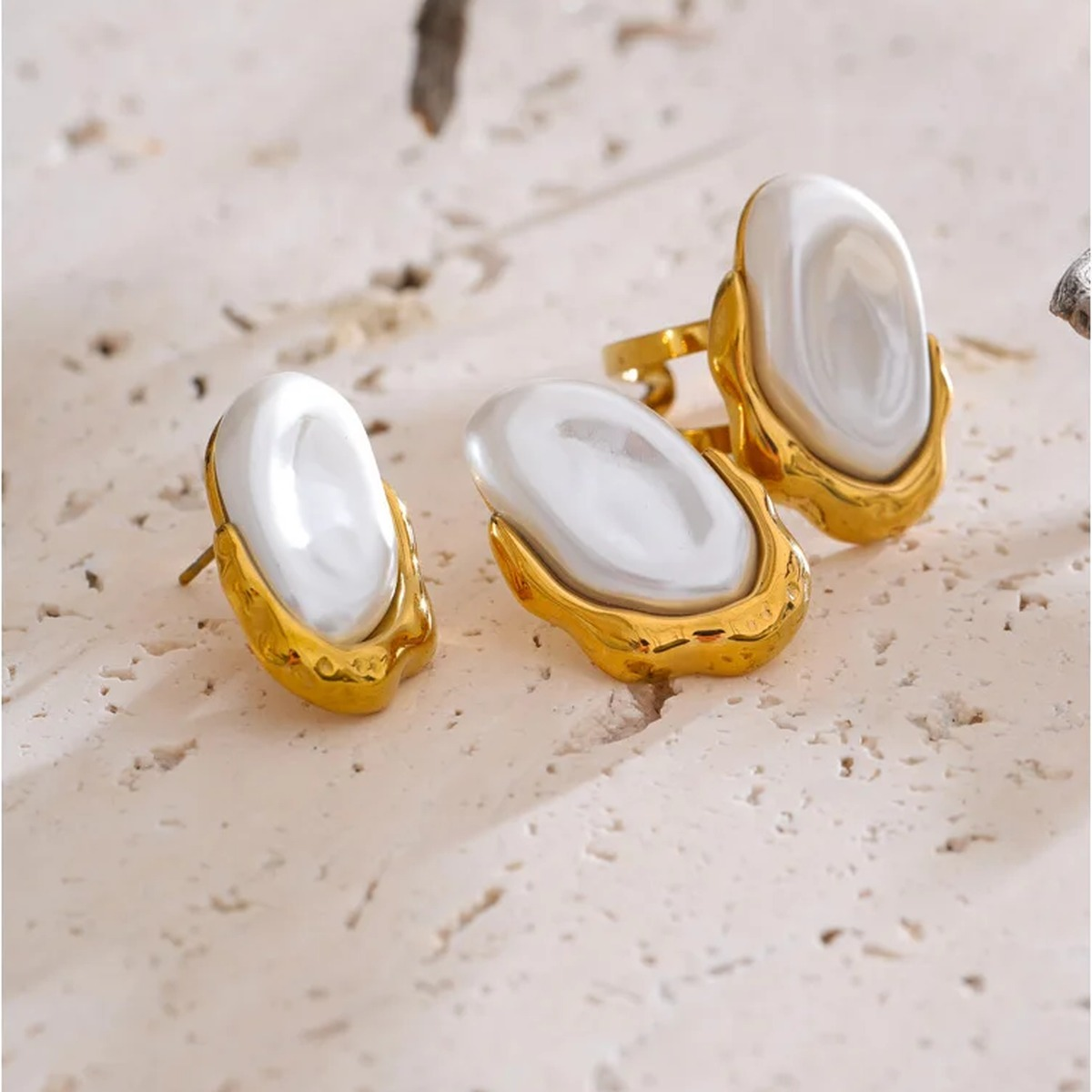 Flat lay of the Anya faux pearl earring and ring set