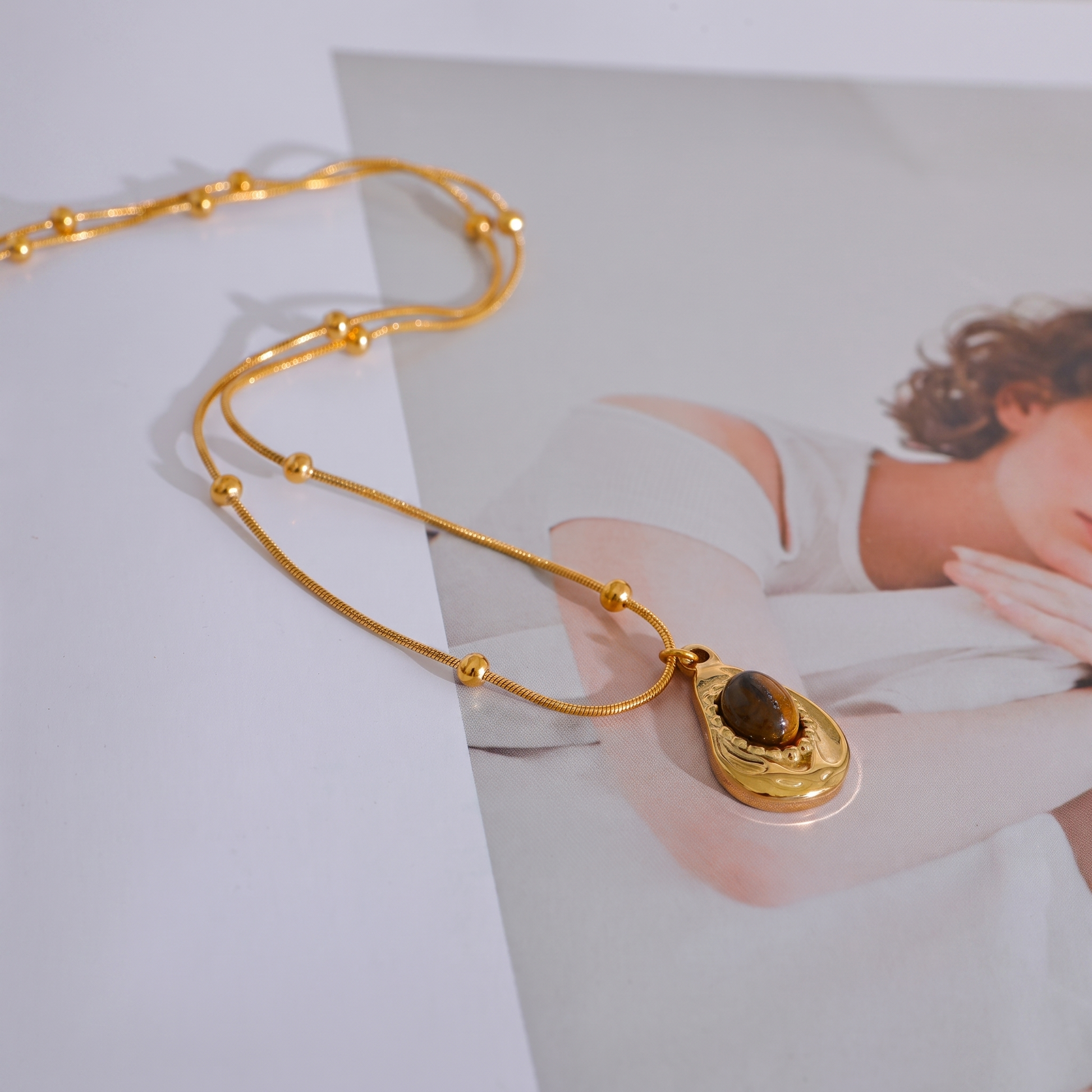 Asha Tiger-Eye Pendant draped chain detail