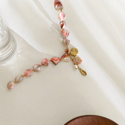 Coralie shell necklace flat lay with props