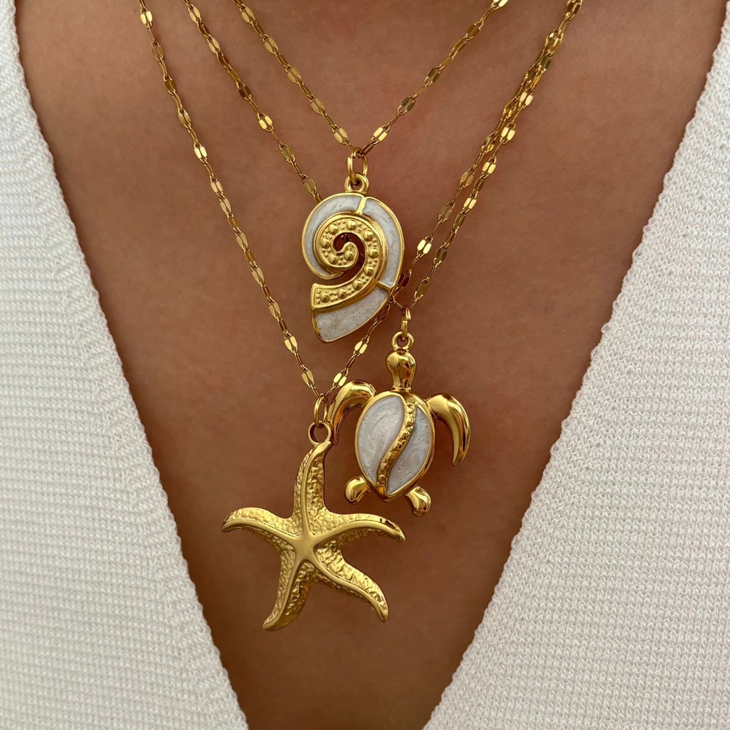 Corsica sea charm necklace set layered on a model
