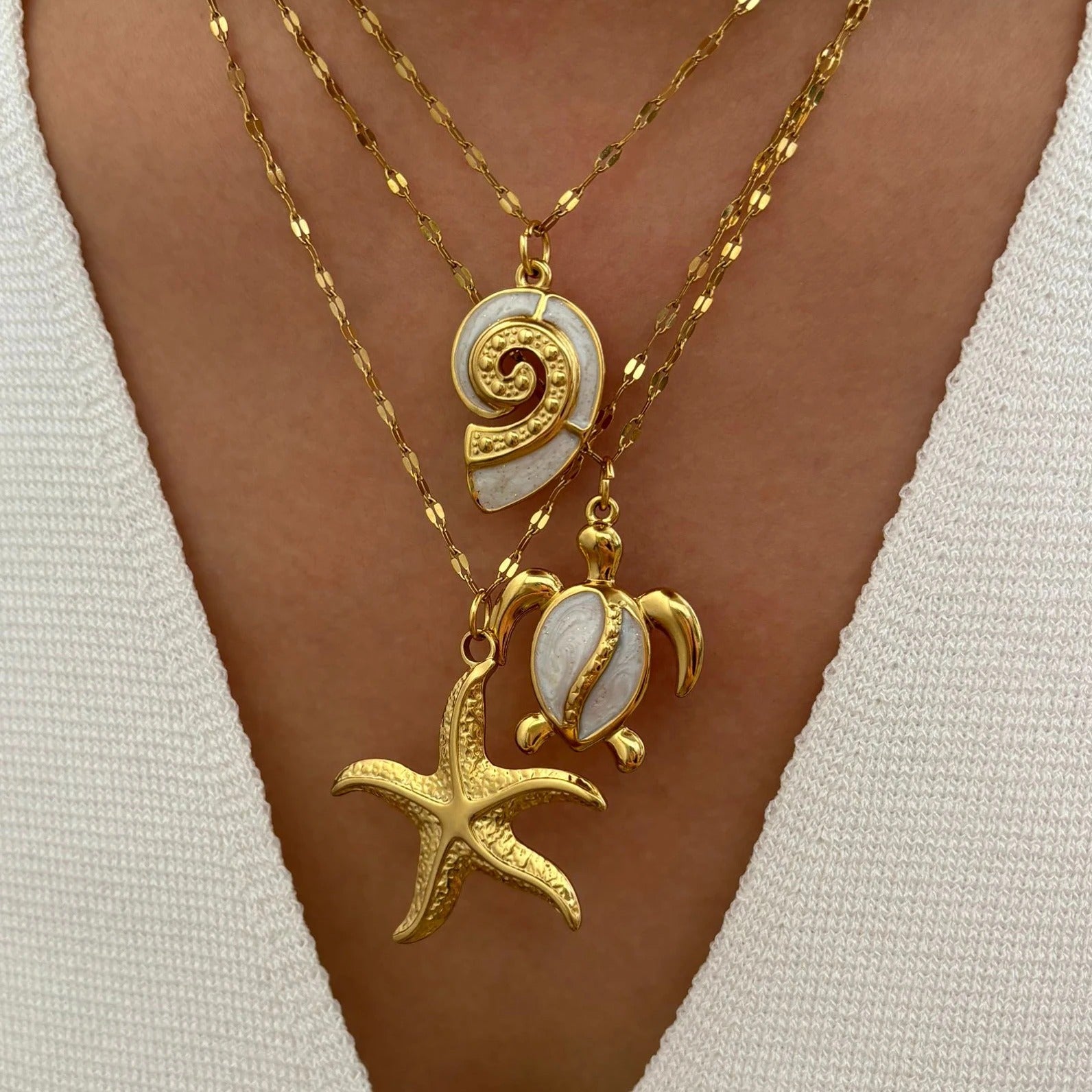 Corsica sea charm necklace set layered on a model