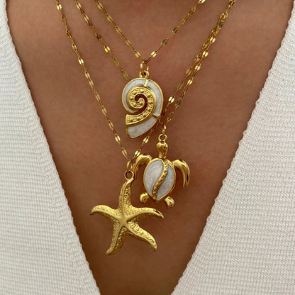 Corsica sea charm necklace set layered on a model
