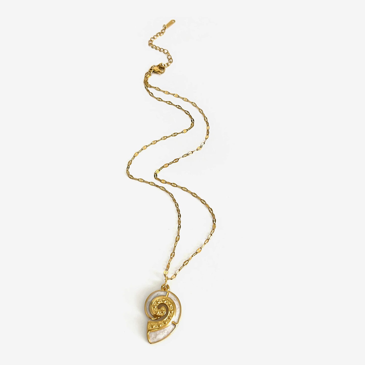 Corsica gold conch shell pendant necklace laid flat