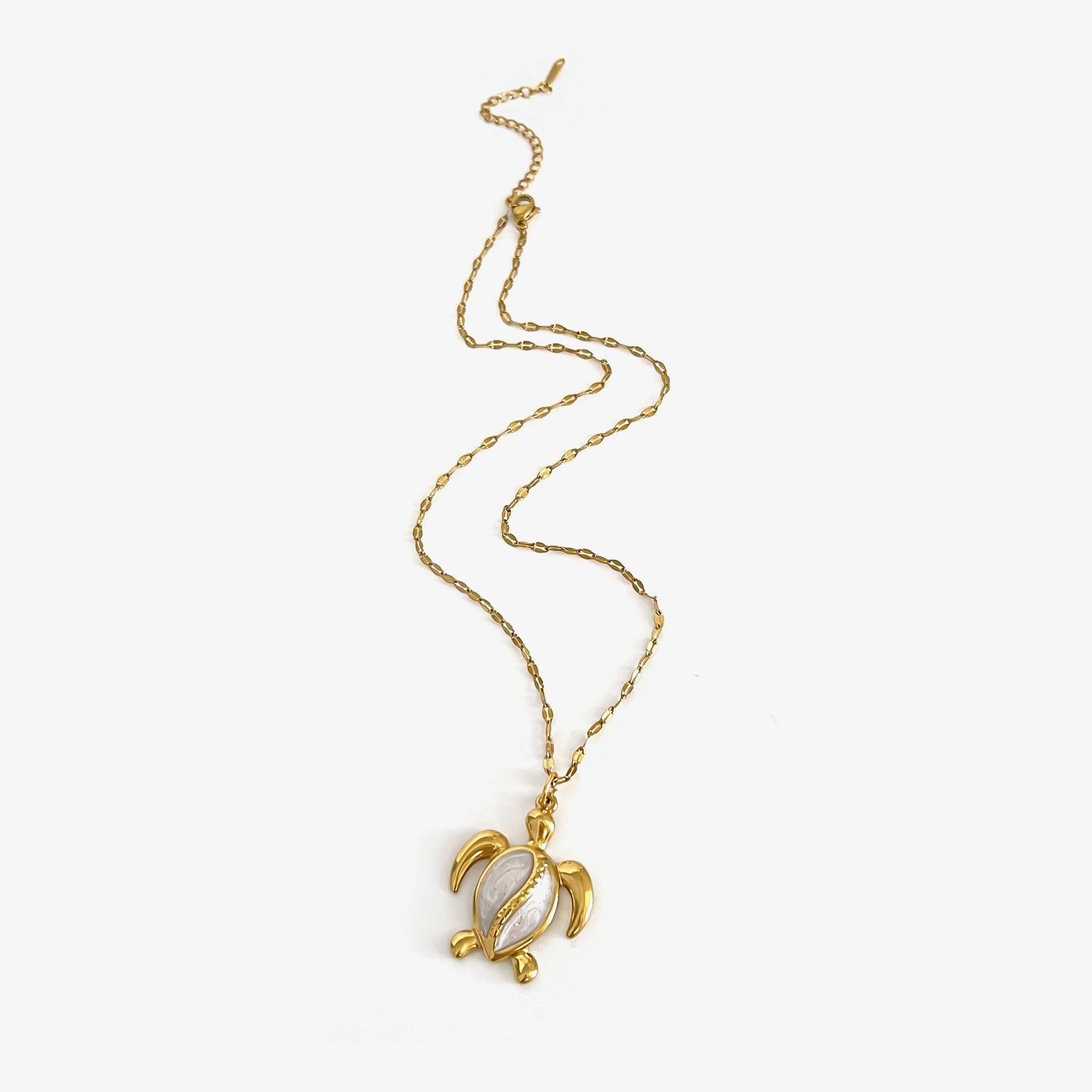 Corsica gold sea turtle pendant necklace laid flat