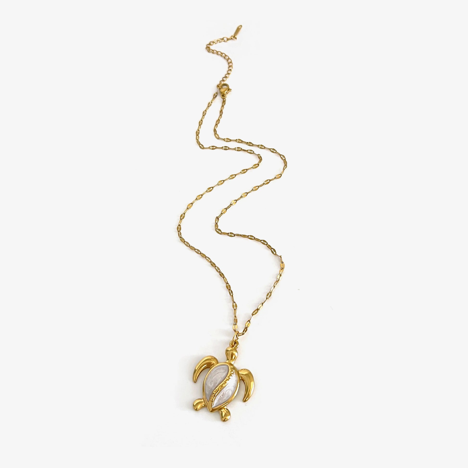 Corsica gold sea turtle pendant necklace laid flat
