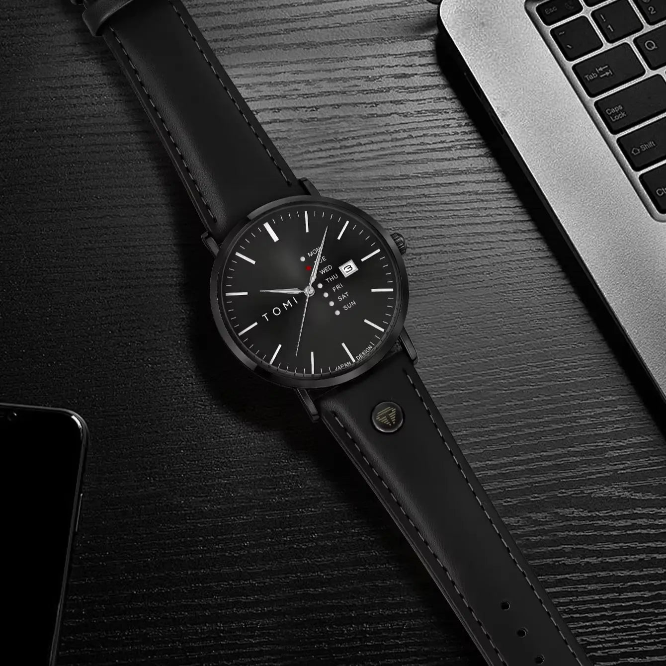 Dalton Calendar Watch in all black styled on a desk
