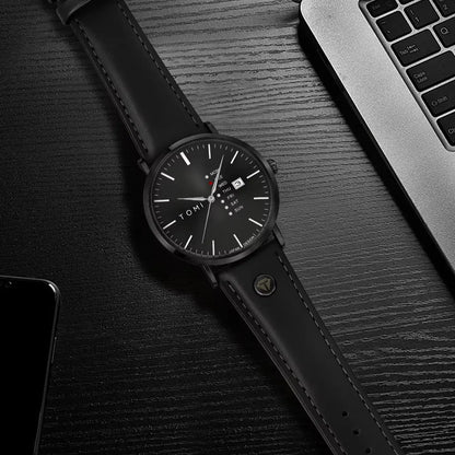 Dalton Calendar Watch in all black styled on a desk