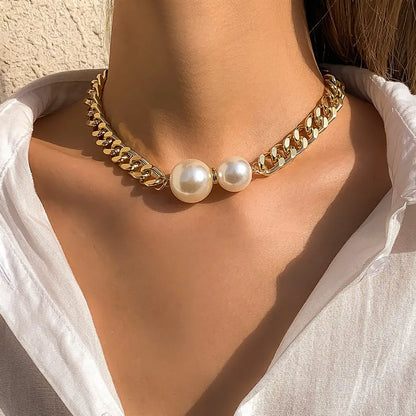 Delilah pearl Cuban-link necklace in gold, worn
