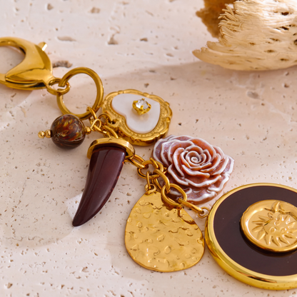 Elba-Sun-Charm-Keyring Gold Burgundy — studio 2