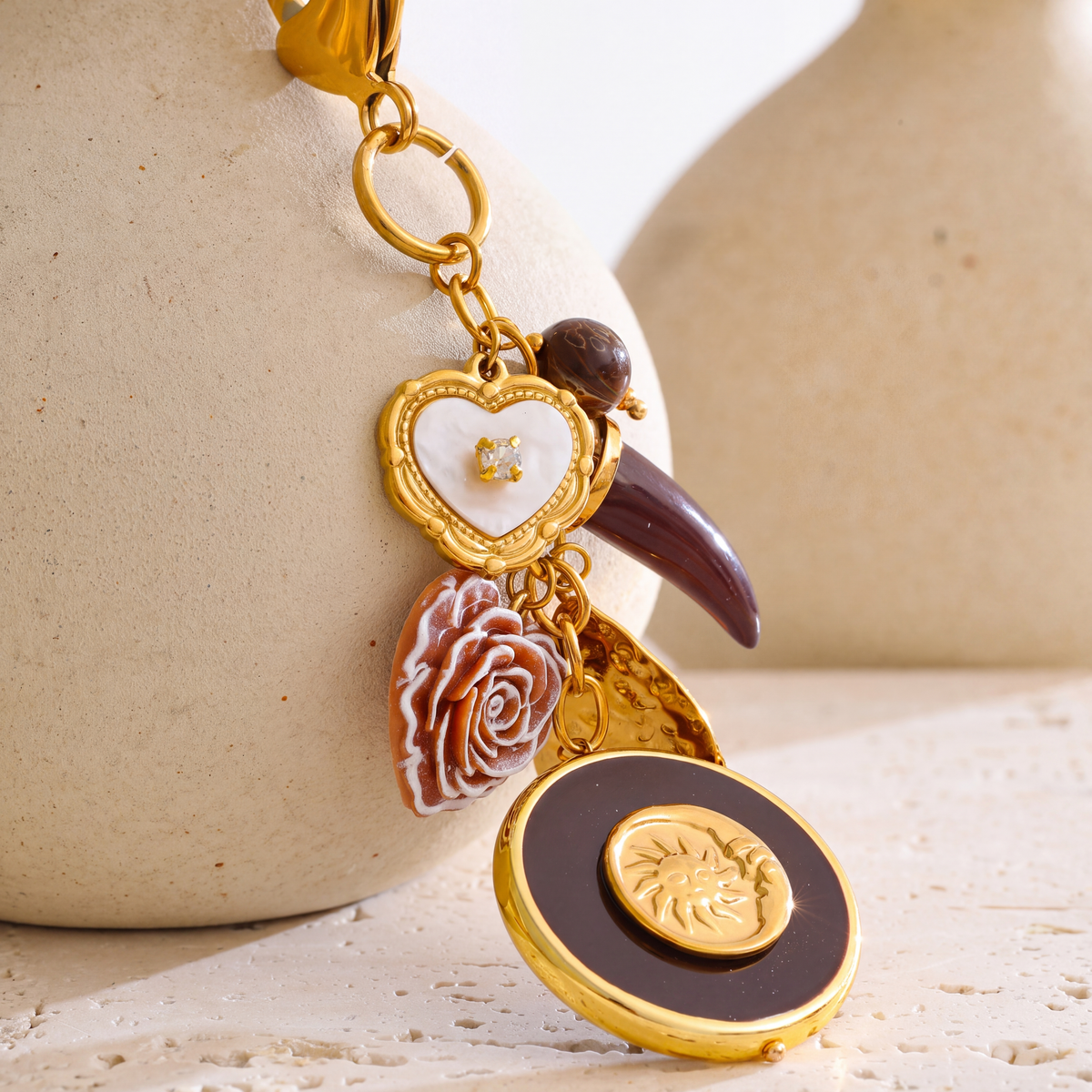 Elba-Sun-Charm-Keyring Gold Burgundy — studio 3