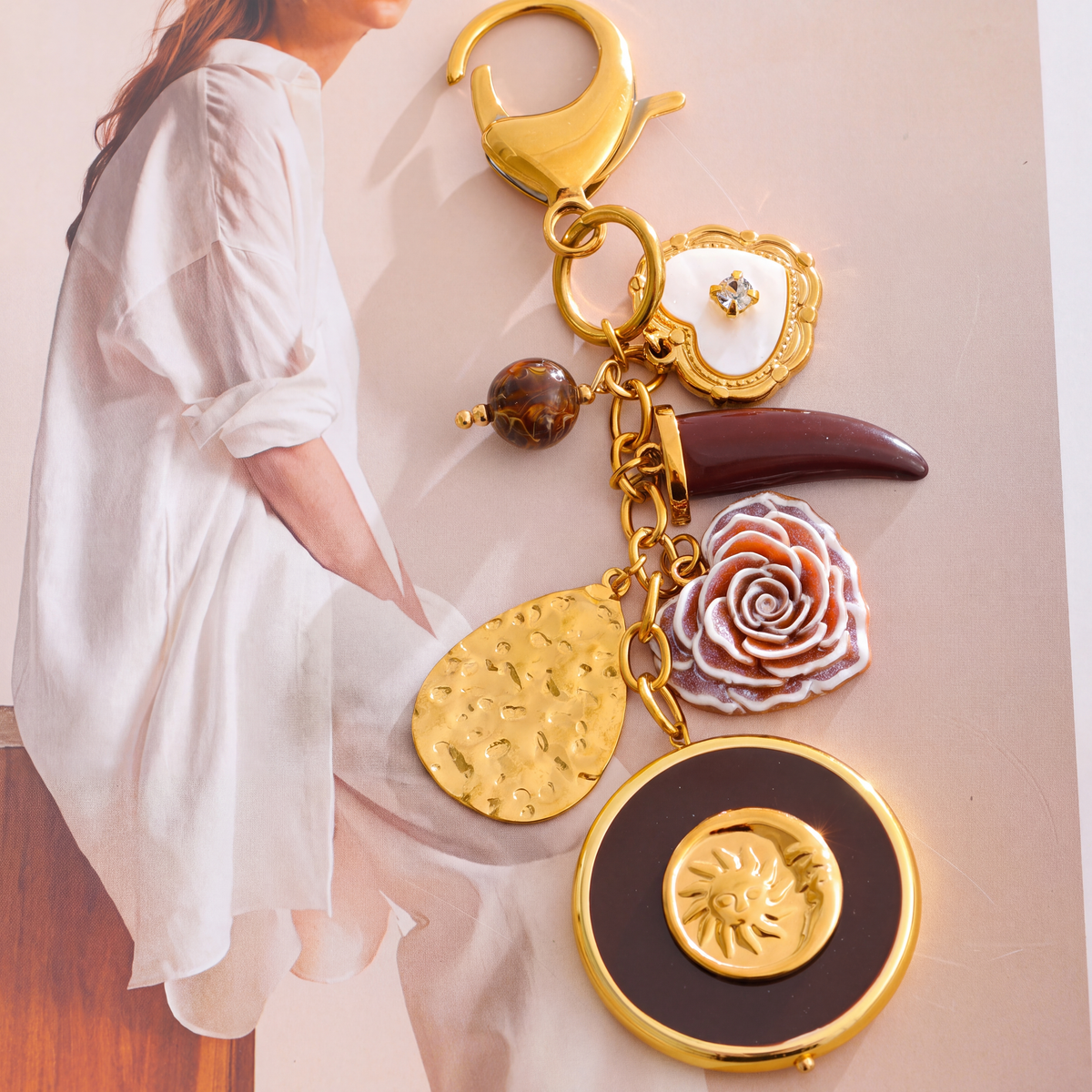 Elba-Sun-Charm-Keyring Gold Burgundy — studio 4