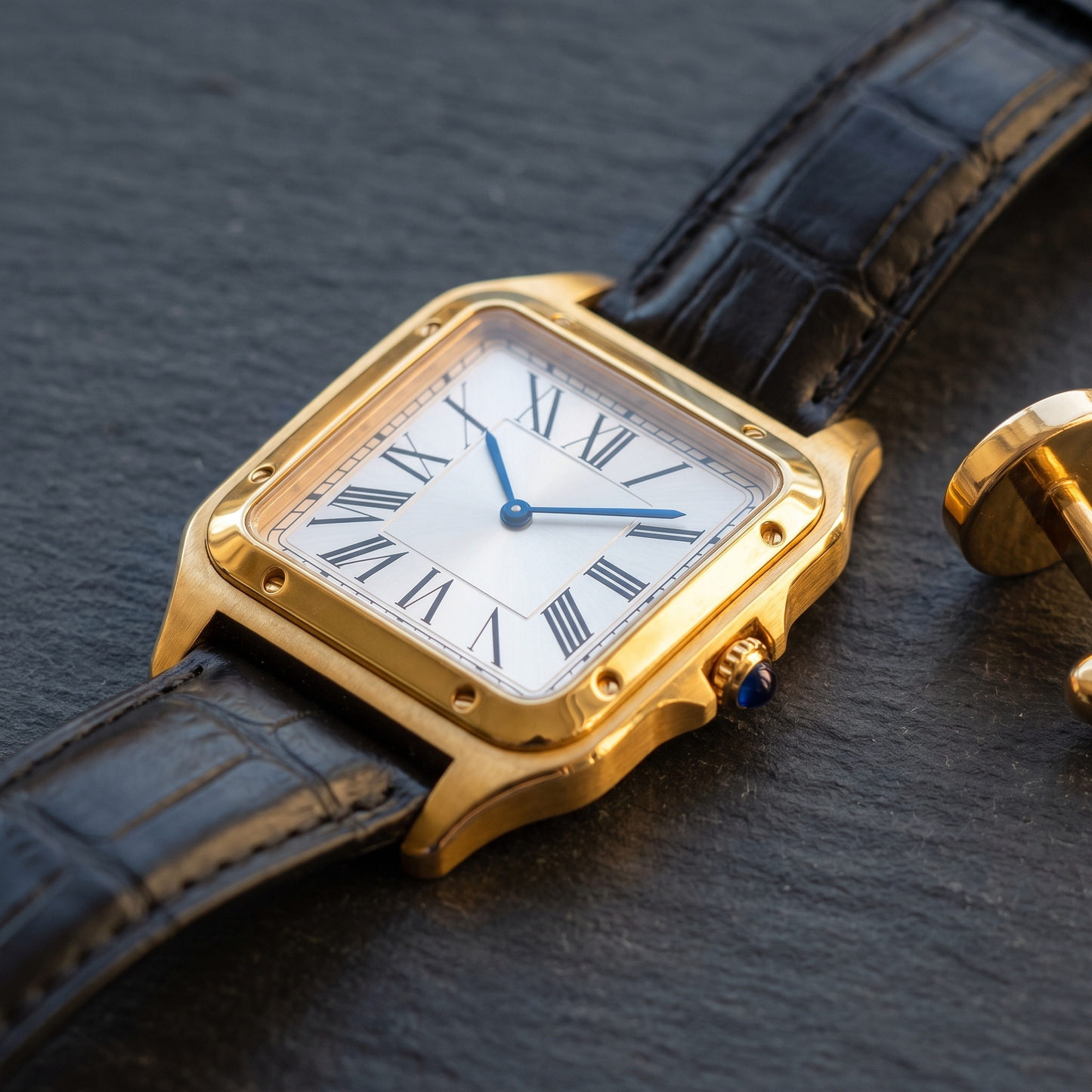 Ellis Gold Black Croc Watch styled flat-lay on dark slate, gold square case with black croc leather strap and blued hands