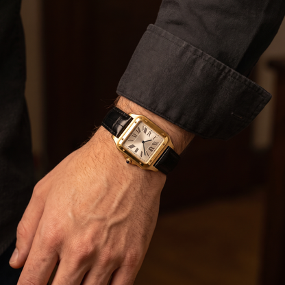 Ellis Gold Black Croc Watch worn on the wrist below a shirt cuff, gold square case with black croc leather strap