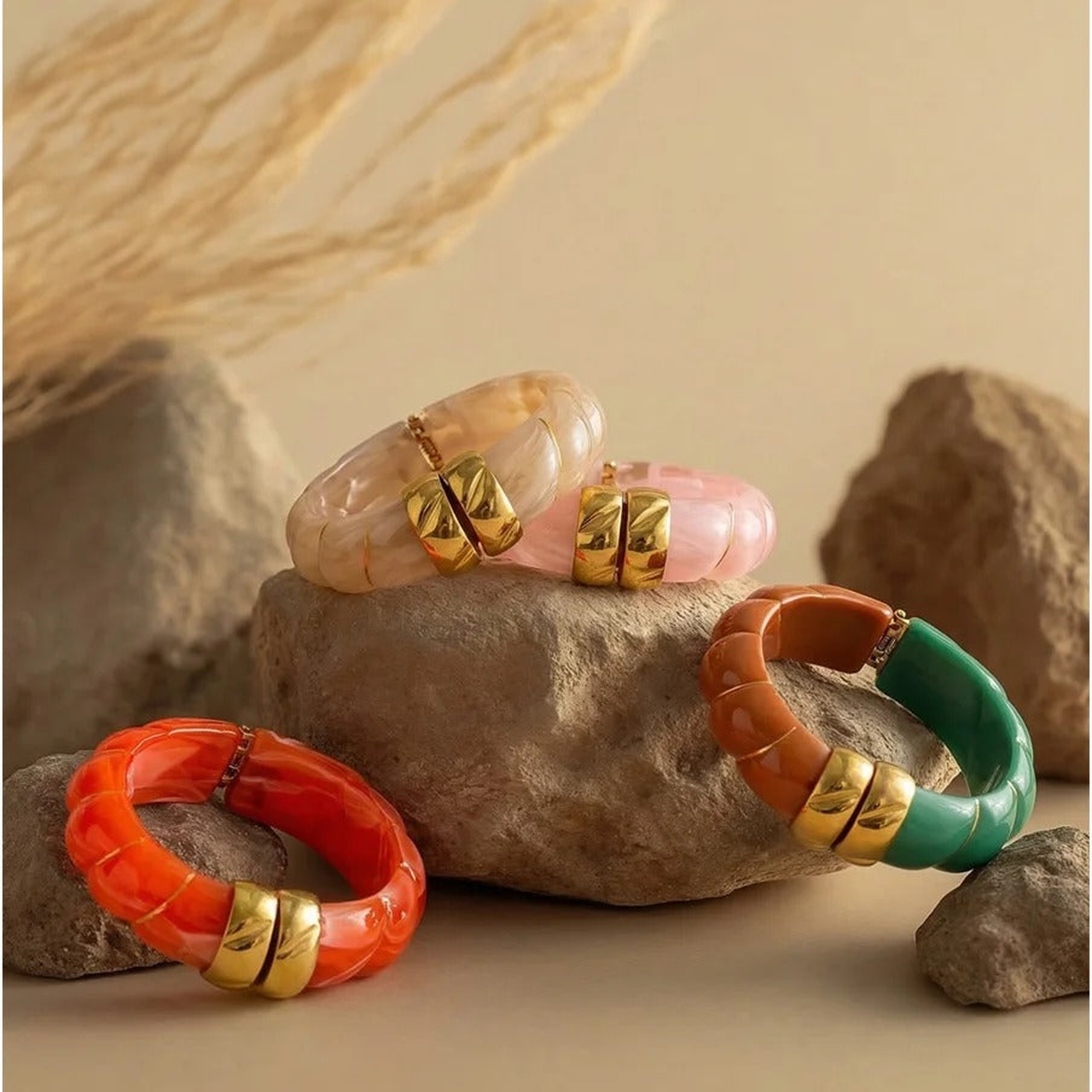 Sonoma resin cuff bangles styled on stone in warm daylight