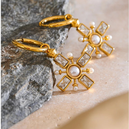 Emery zirconia drop earrings styled on stone