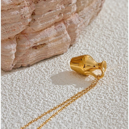 Close view of the Ravello gold-tone vase pendant