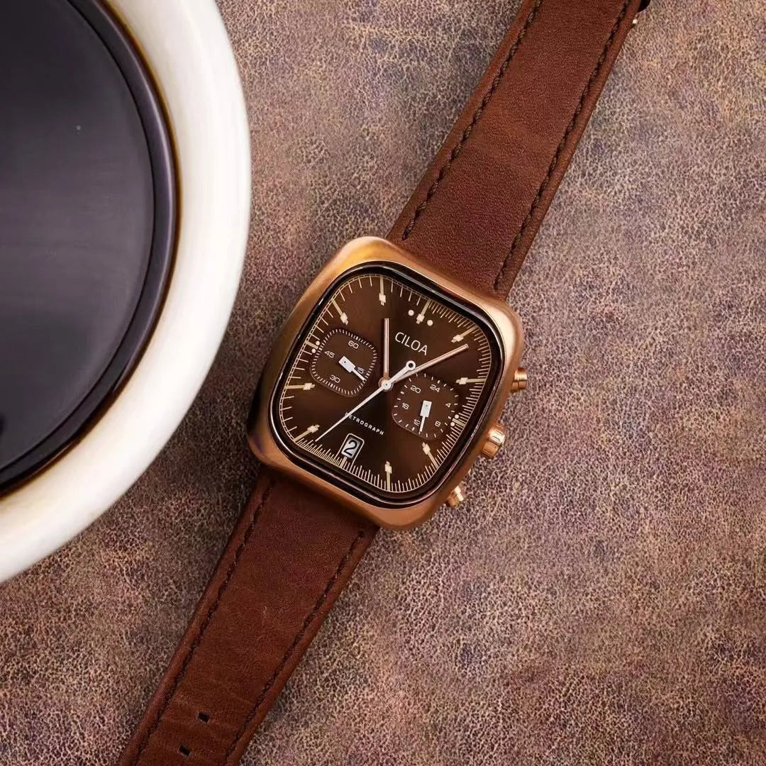 Holt square chrono watch, brown leather strap, styled beside a coffee cup